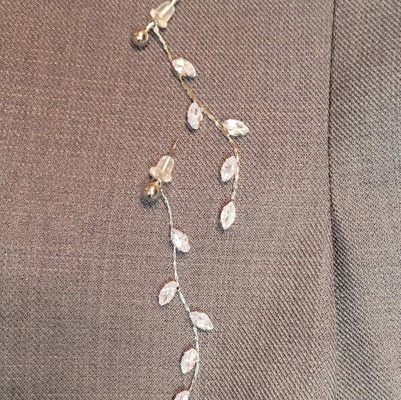 Elegant, simple crystal silver color metal dangle earrings with plastic backing. - Picture 3 of 5